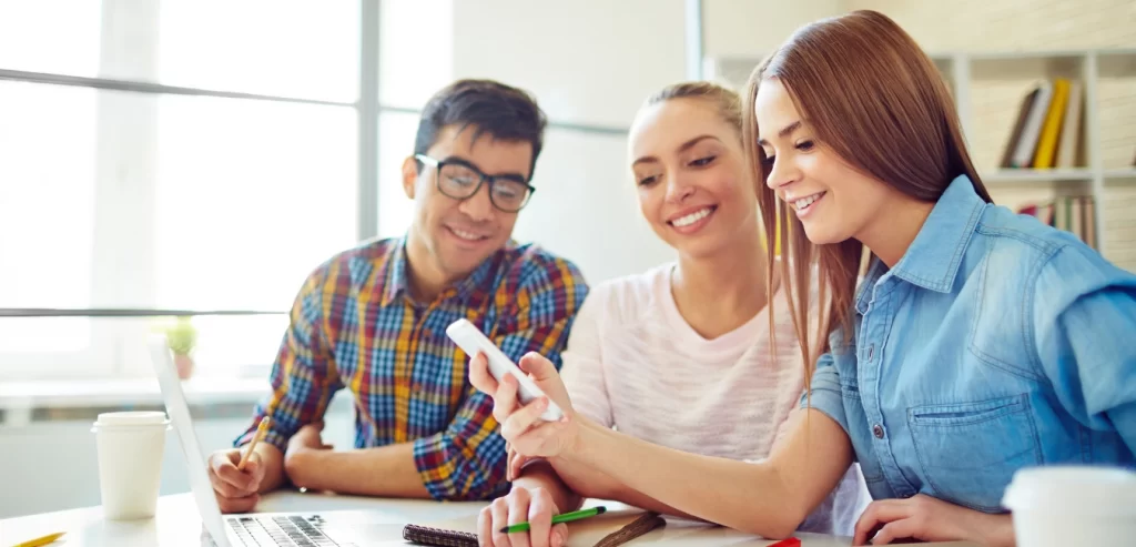 Three co-workers brainstorming a content strategy.